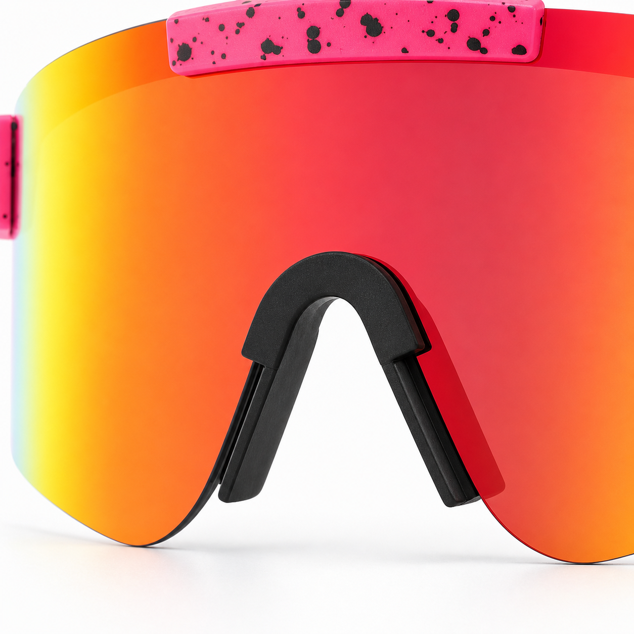 Close-up of sports sunglasses showing rubber nose pads, vented lens, and grippy temple tips