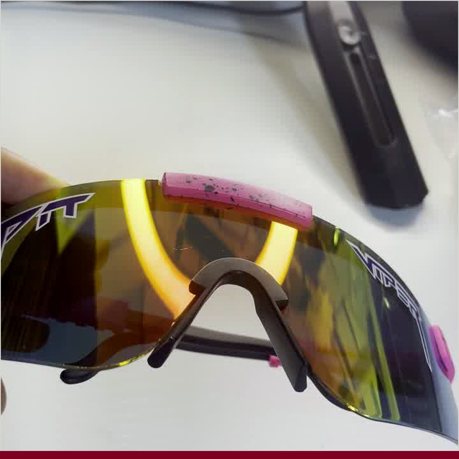 UK trail scene: runner adjusting sunglasses with misty trees and soft light showing variable weather